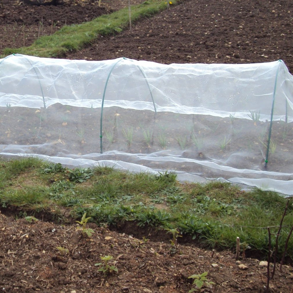Garden Netting Draped Over Green Flexible Hoops